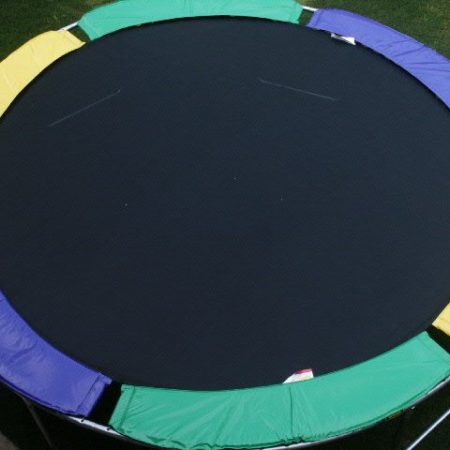 An overhead view of a purple, yellow, and green trampoline without net enclosure