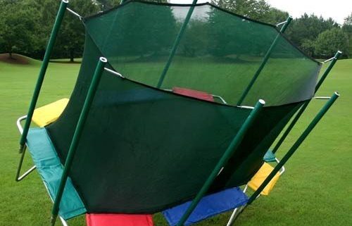 A red, green, yellow, and blue rectangle Magic Circle trampoline tips over.