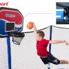 A boy dunks his trampoline basketball with an image of the rim springs hovers above his head