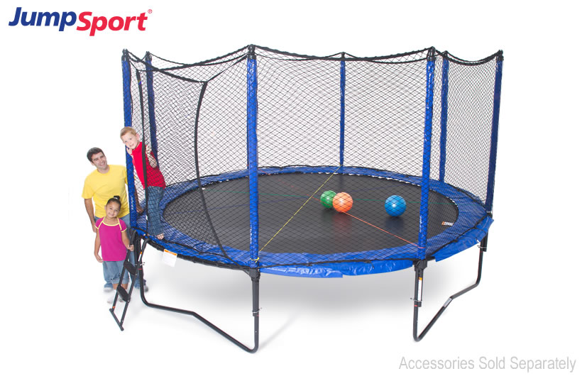 two kids and a man pose next to a JumpSport SoftBounce trampoline