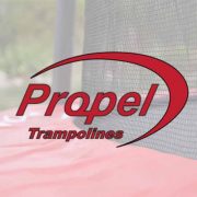 The Propel Trampolines logo superimposed over a blurry picture of a spring pad protector