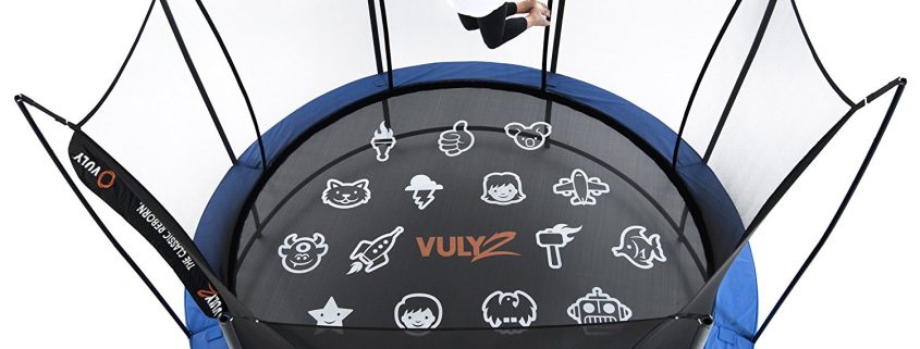 A girl in white shirt and black pants sails above a Vuly 2 with HexVex game mat
