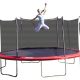 A blond mom in white pants jumps on a red Propel trampoline