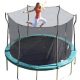 Blond mom jumps and flairs arms on trampoline