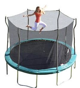 Blond mom jumps and flairs arms on trampoline